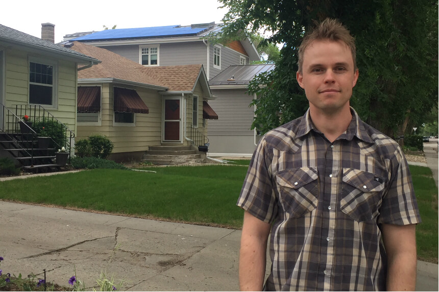 Matt Pointer, a member of Wascana Solar Cooperative, stands in front of his solar powered house on June 17, 2018.